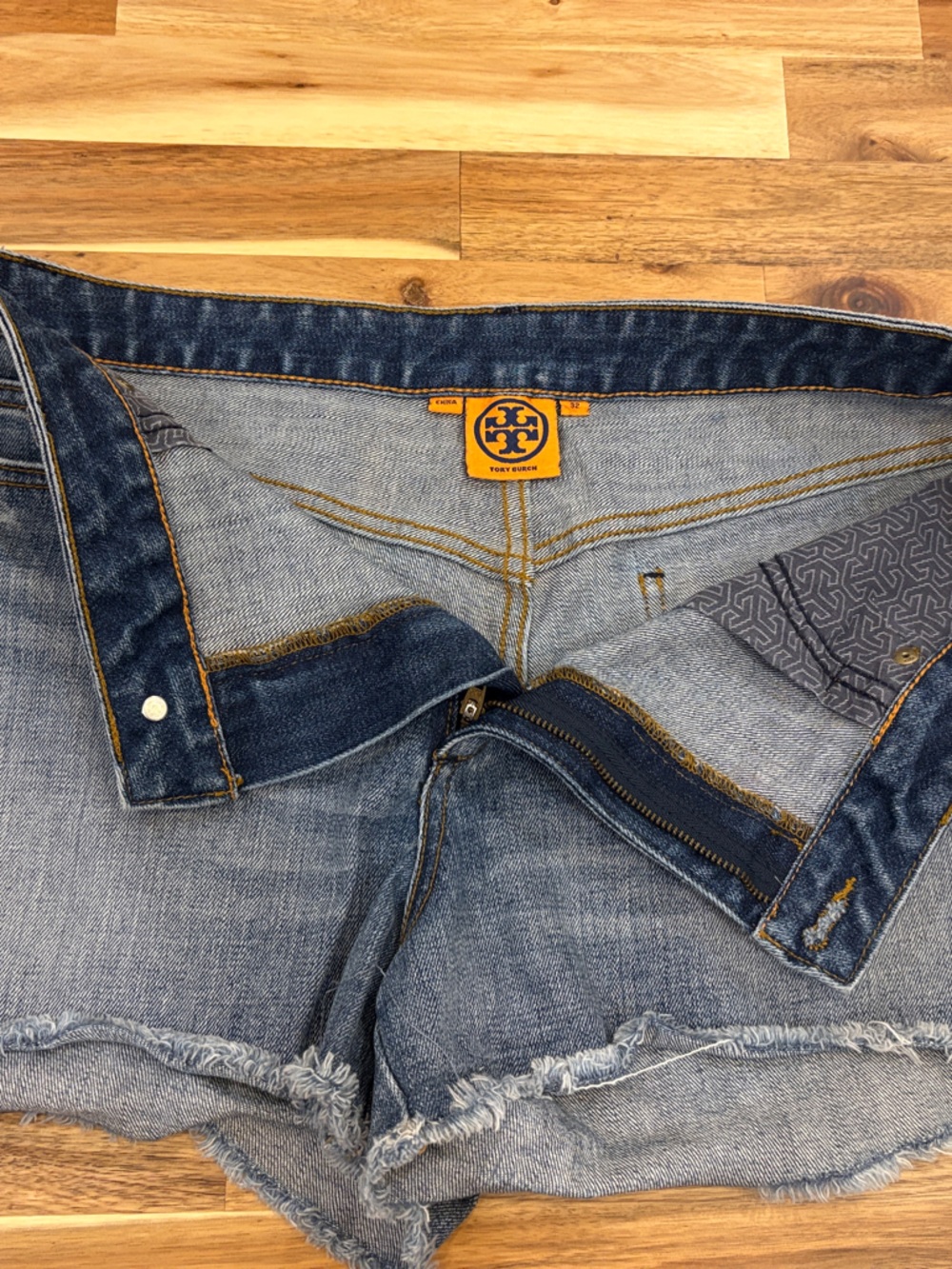 Tory Burch Distressed Light Blue Denim Shorts with Frayed Hem
